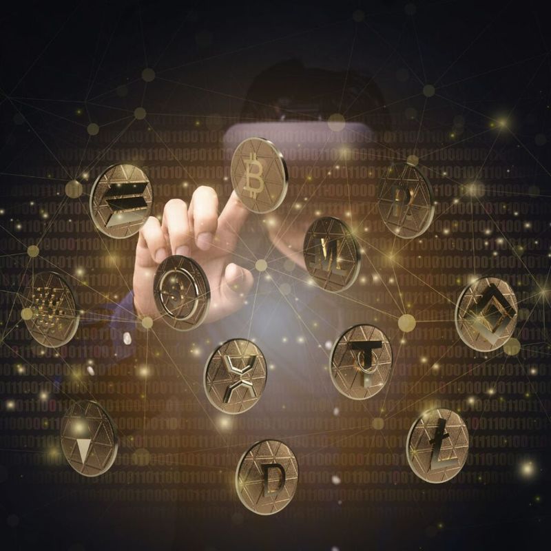 Digital illustration of a hand touching glowing cryptocurrency coins, including Bitcoin, connected by a network